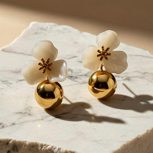 Chévereh beige hibiscus floral ball drop earrings with gold centers and polished gold balls.