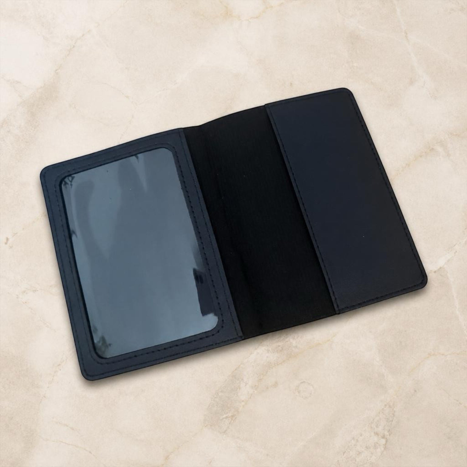 Chévereh black PU leather passport holder with a clear ID window and card slots for travel organization.