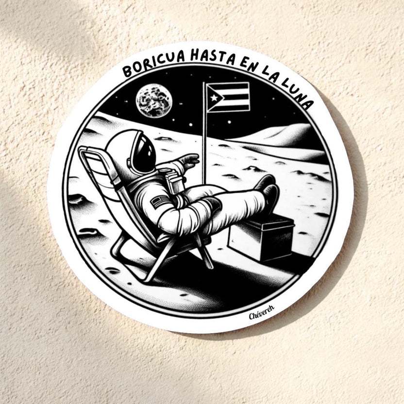 Chévere sticker: Astronaut relaxing on the moon with Puerto Rican flag and text "Boricua Hasta En La Luna".