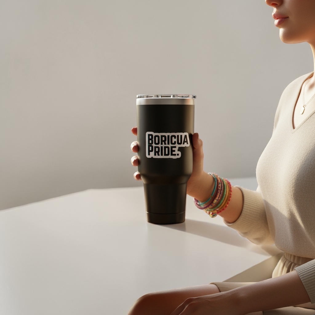 Chévereh Boricua Pride vinyl sticker with blue accents on a black tumbler held by a woman.