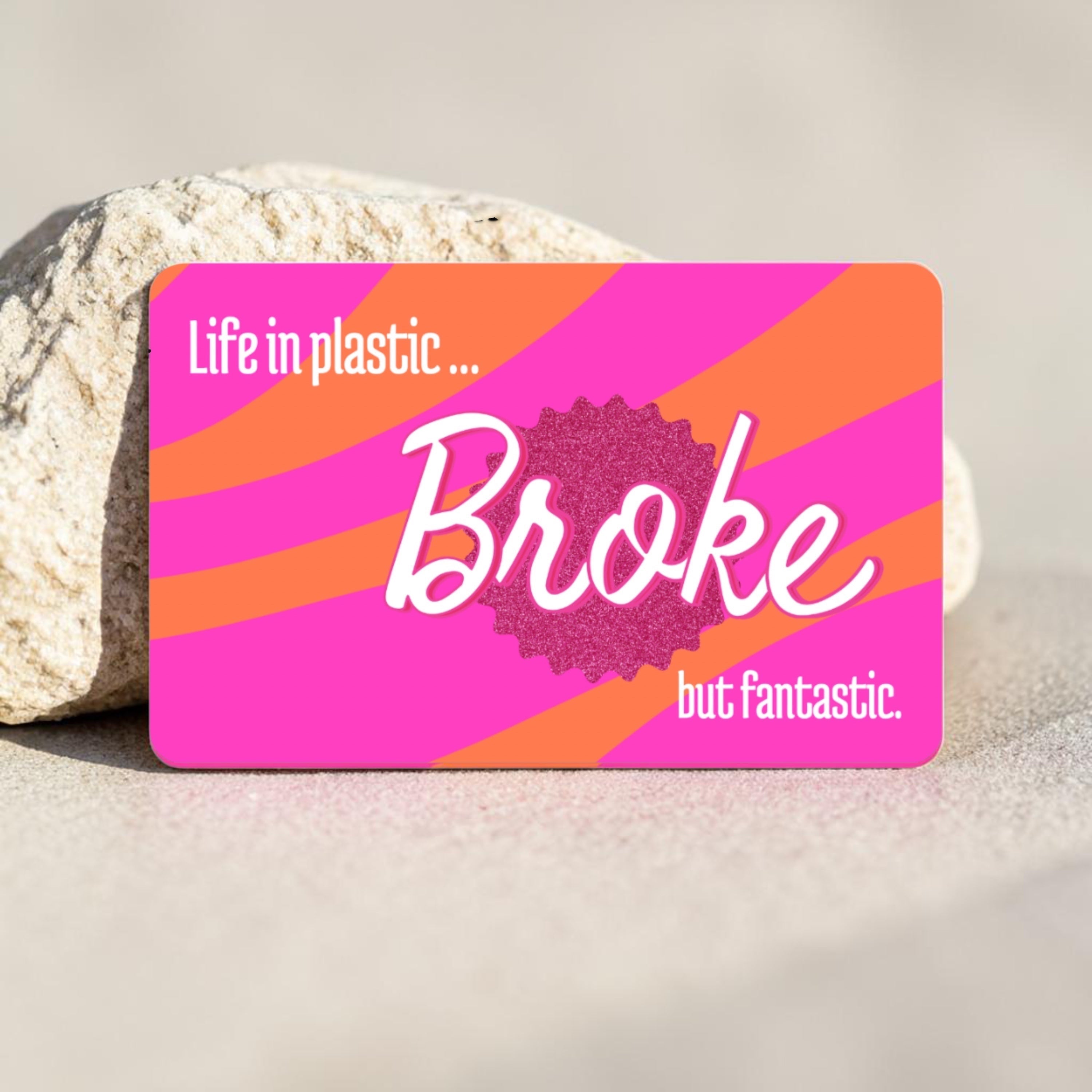 Chévereh waterproof debit and credit card skin with pink and orange stripes and "Life in plastic... Broke but fantastic" text.