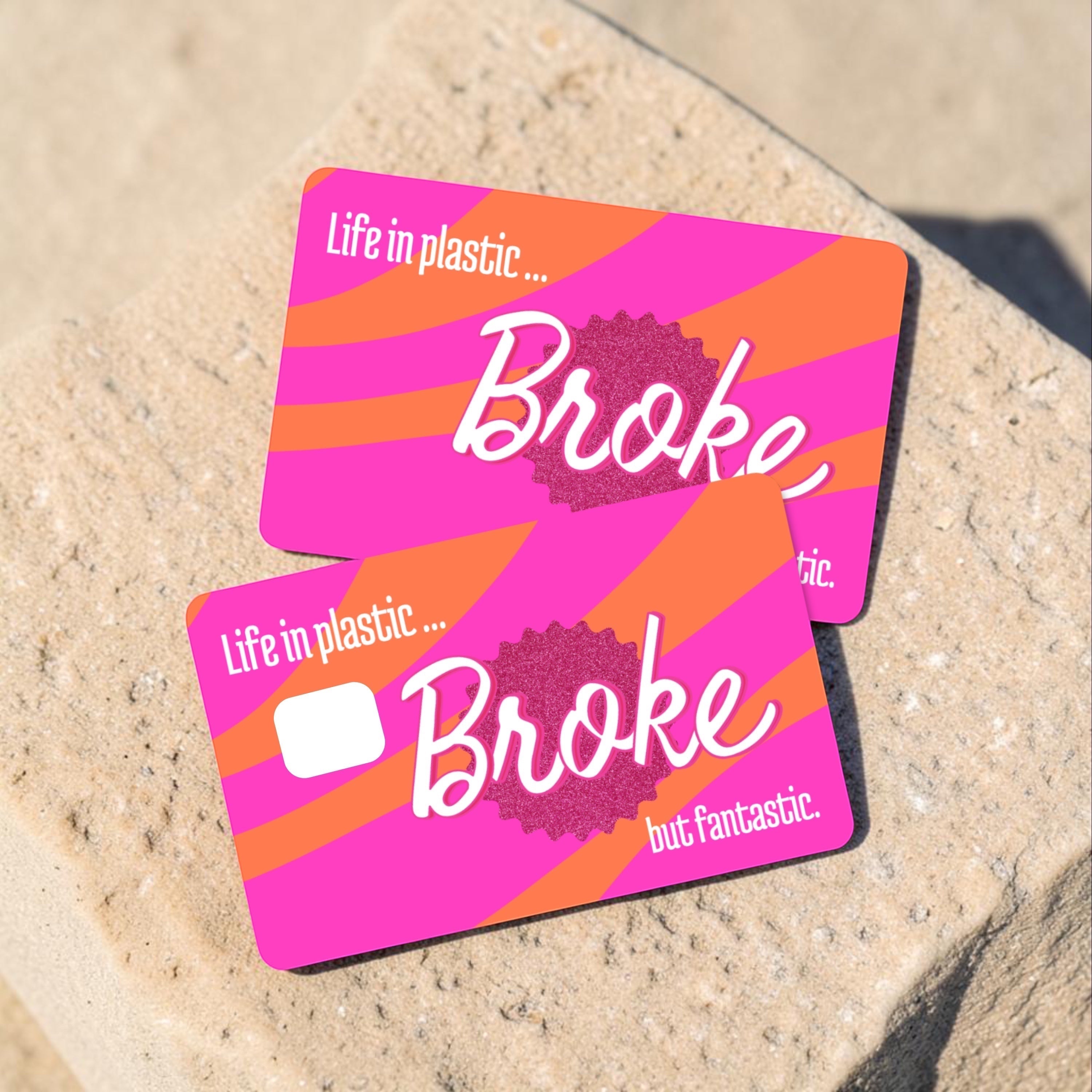 Chévereh waterproof debit and credit card skin with pink and orange stripes and "Life in plastic... Broke but fantastic" text.