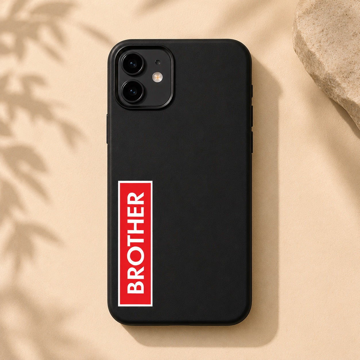 Chévereh "BROTHER" vinyl sticker, waterproof with glossy finish, red and white text on black phone case.