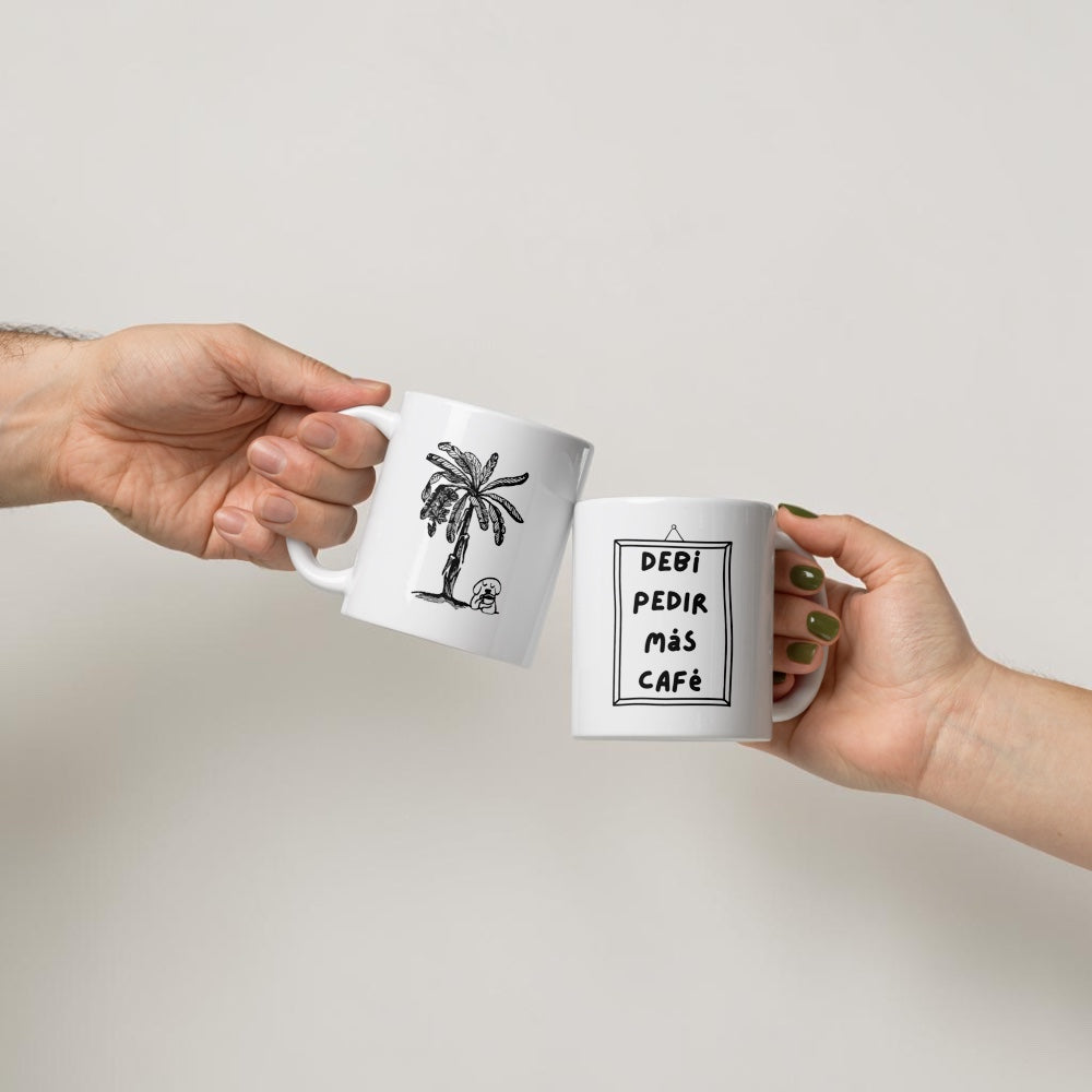 Chévereh ceramic mug with Spanish text "Debí Pedir Más Café" and a palm tree illustration. White mug, 11oz.