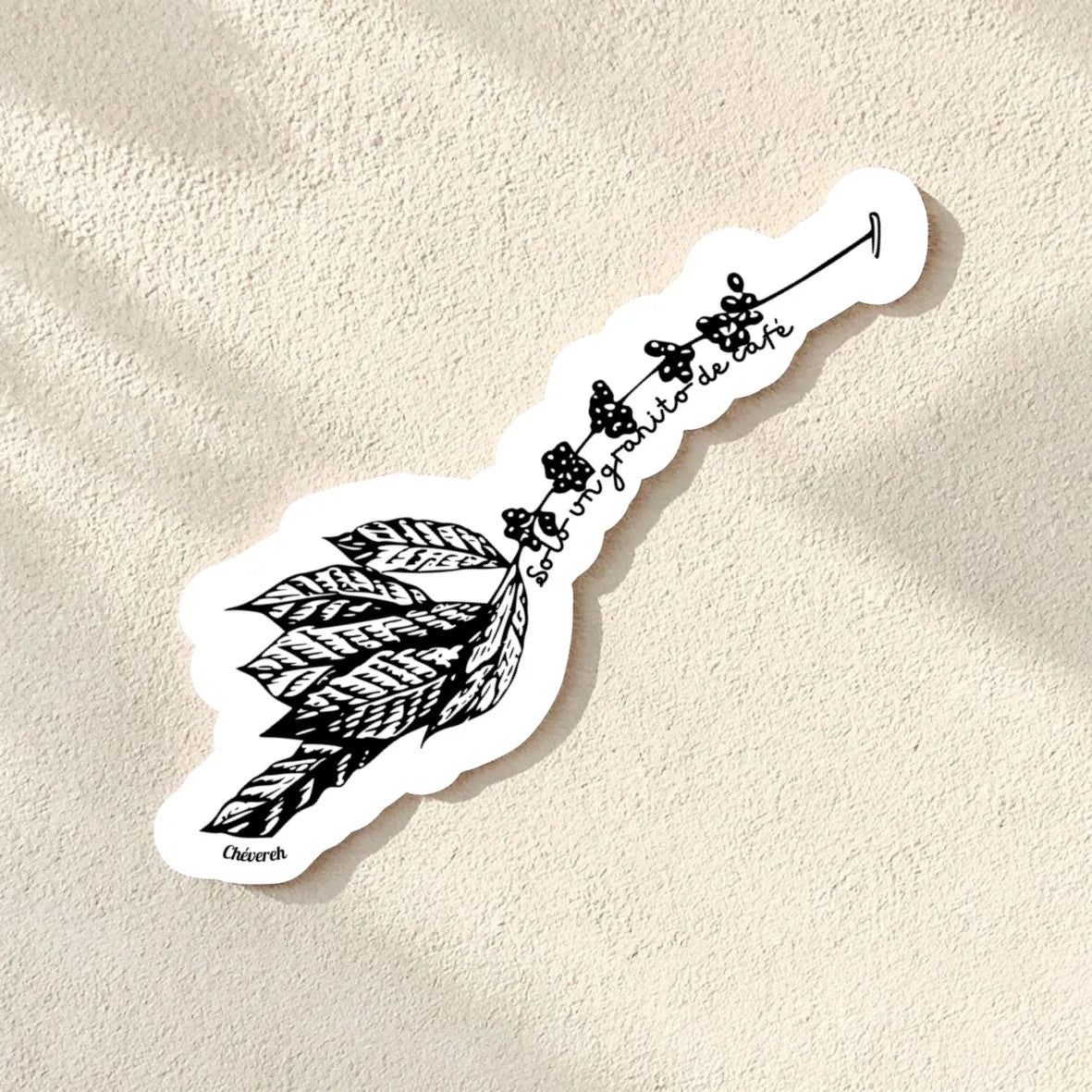 Chévereh black and white vinyl sticker of a coffee branch with beans and leaves, featuring Spanish text "Solo un granito de café". Waterproof glossy finish.