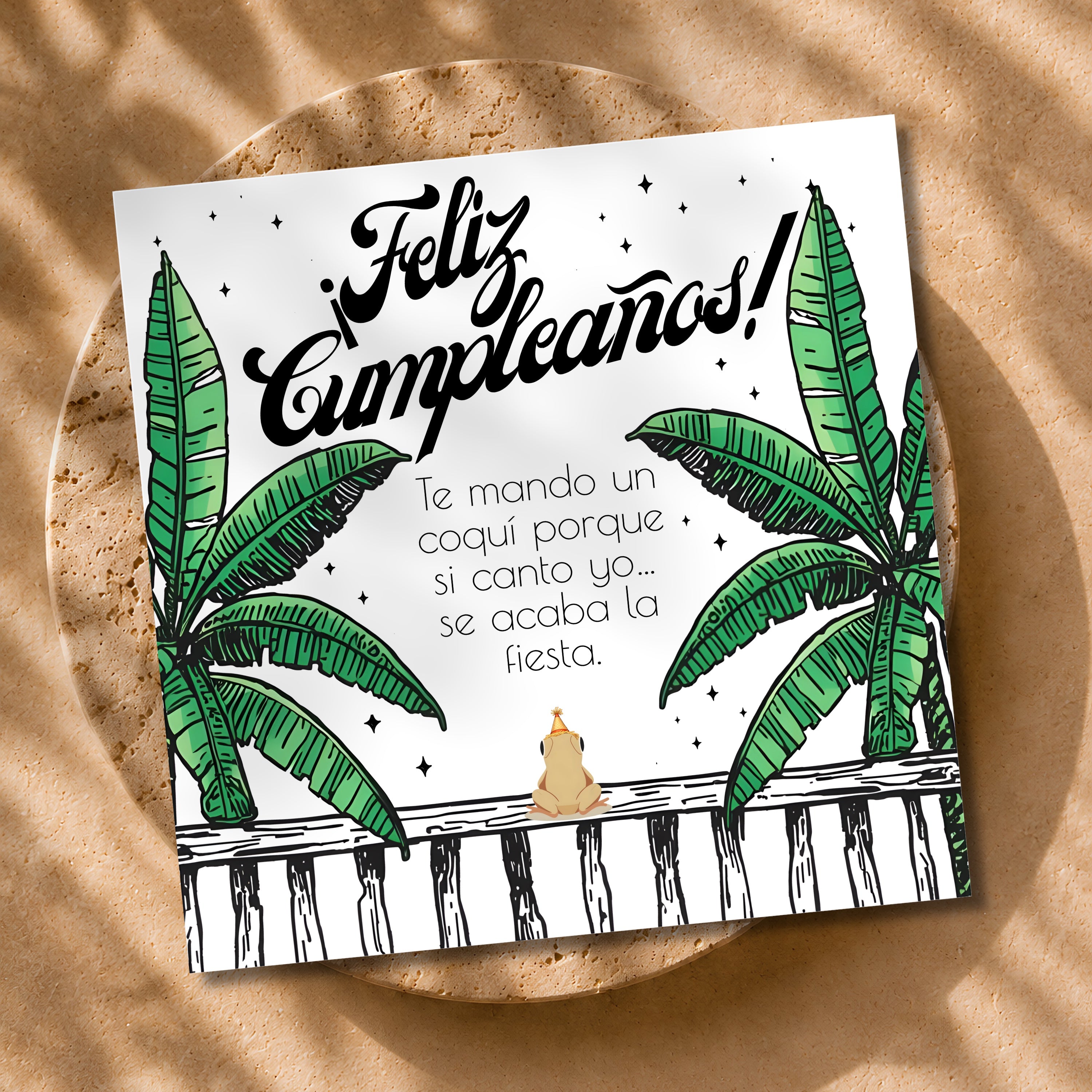 Chévereh Coquí Birthday Card digital download features a cute frog on a fence with banana leaves and Spanish text.