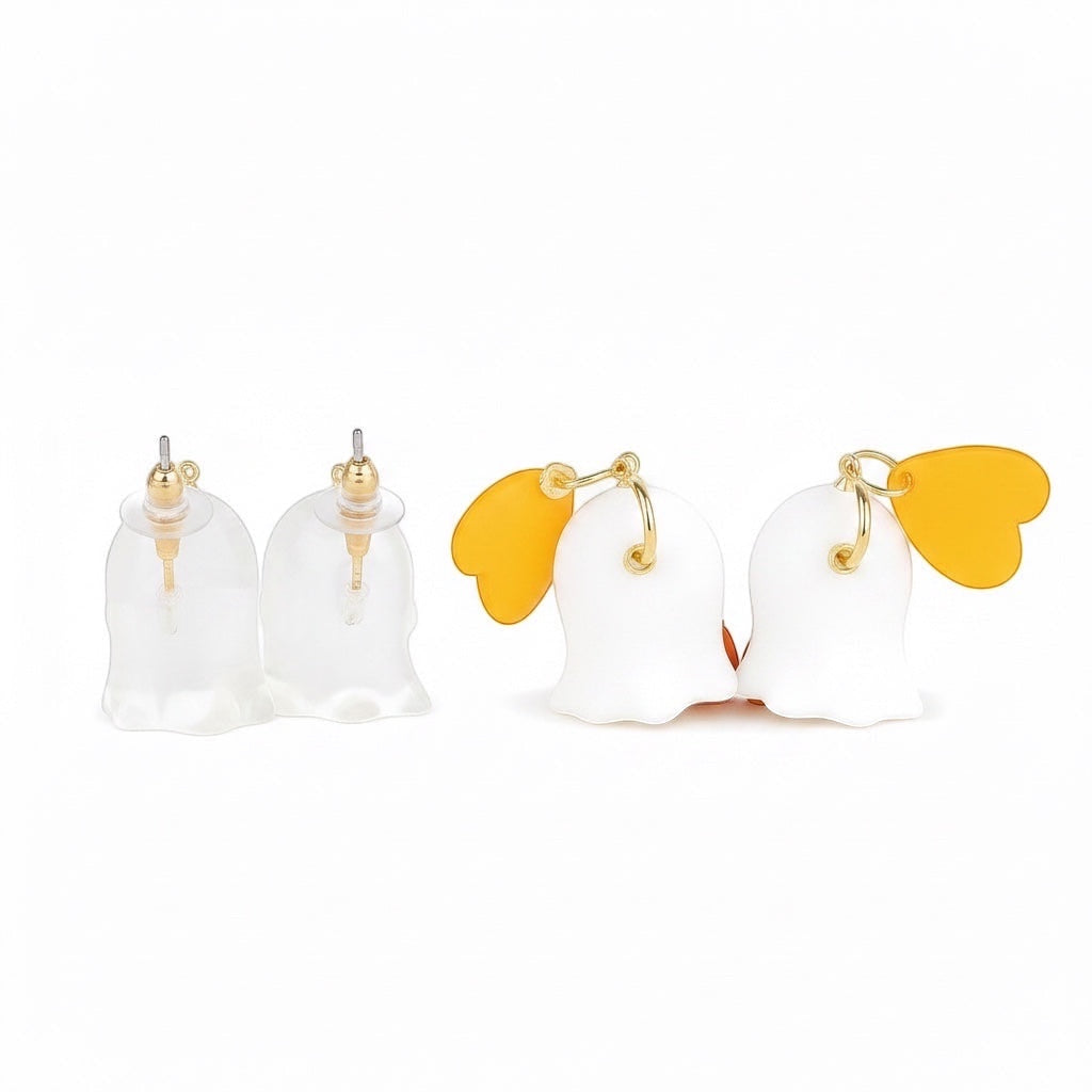 Chévereh Ghost and Pumpkin Earrings with translucent bell-shaped studs and white ghost charms with orange wings.