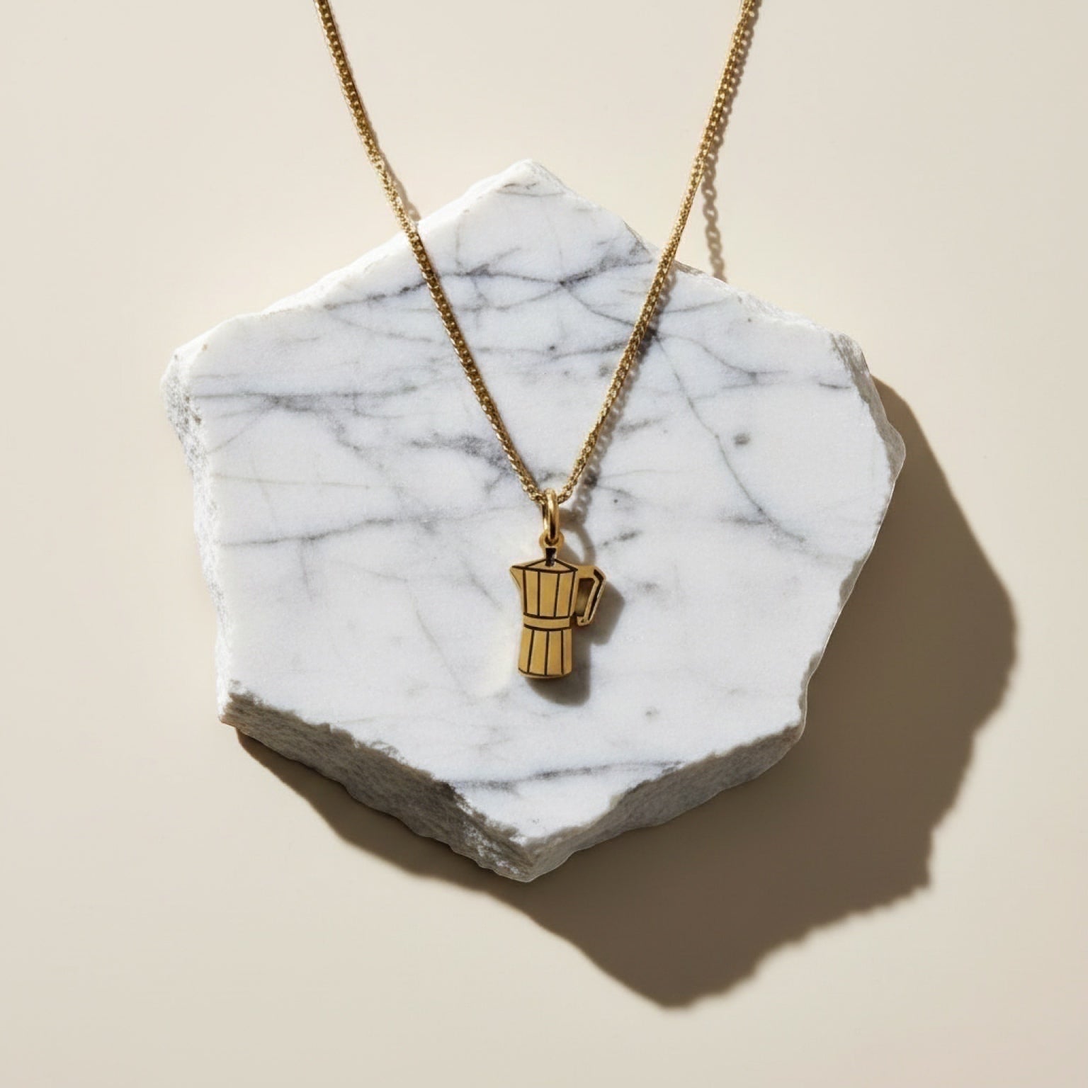 Chévereh Greca Moka Pot charm necklace in gold PVD stainless steel, designed for coffee lovers.
