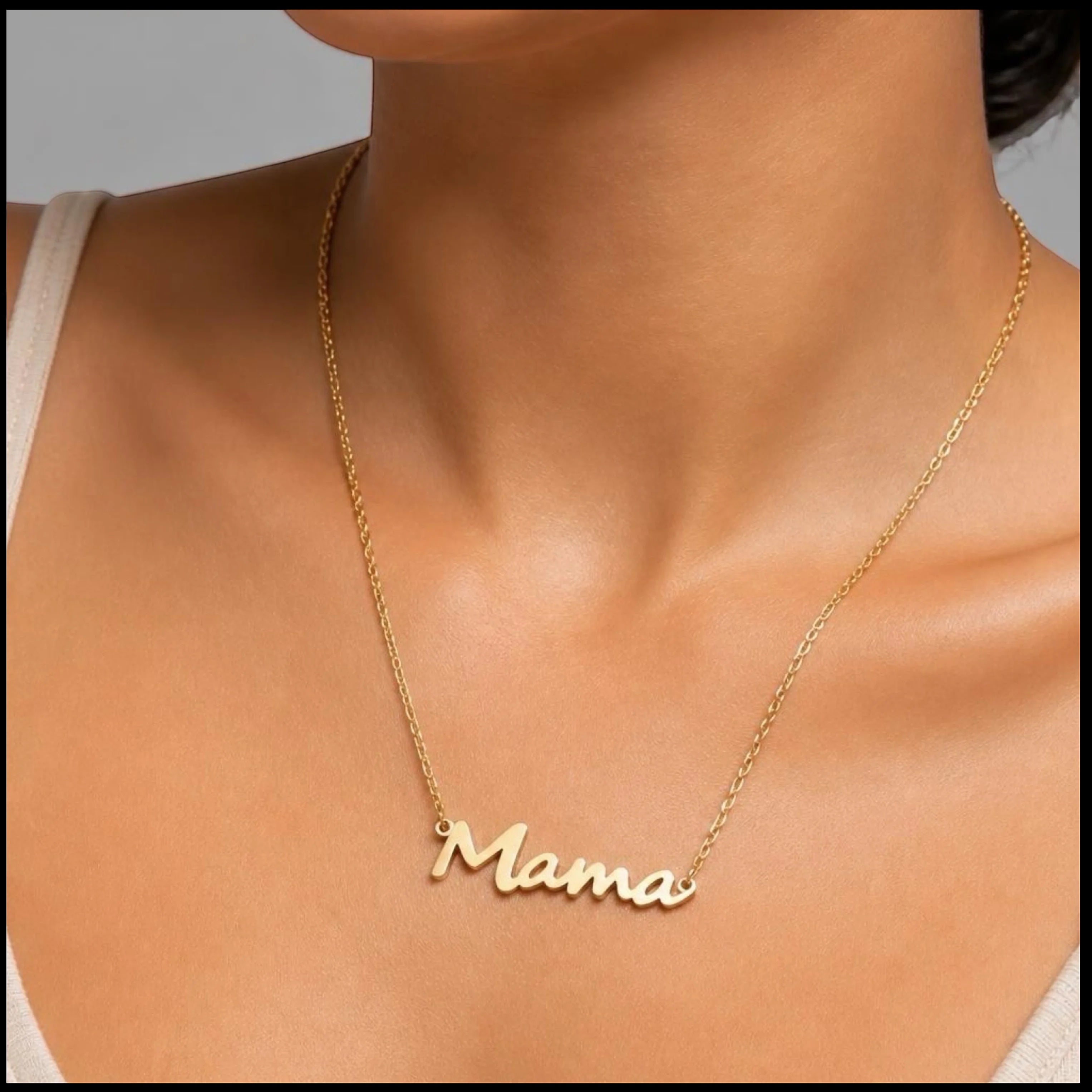 Chévereh gold-tone stainless steel Mama script pendant necklace worn on a woman's neck for everyday style.