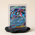 Chévereh Mega Greninja EX 322/086 Full Art Ultra Rare Pokémon card with textured holofoil finish in a protective case.