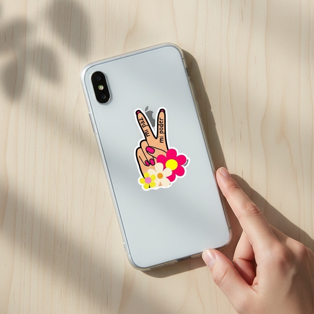 Chévereh Mi Paz Mi Poder vinyl sticker with peace sign hand, flowers, and Spanish text on a phone.