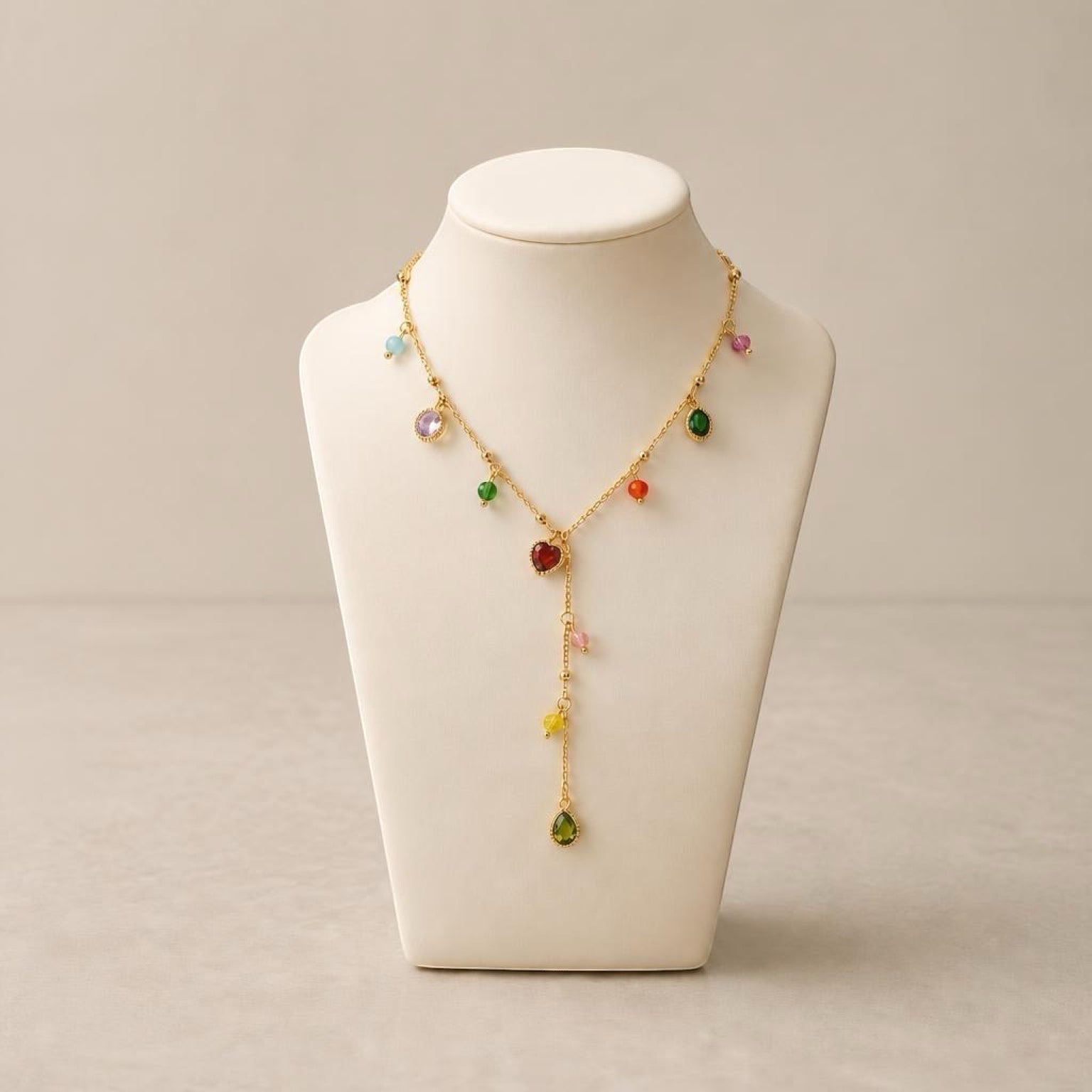 Chévereh dainty gold-tone stainless steel necklace featuring a drop pendant with colorful multifaceted stones.