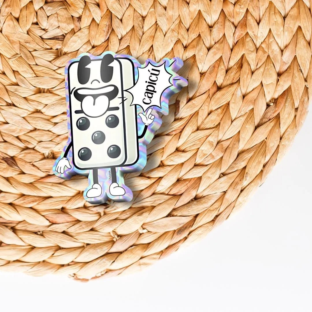 Chévereh Puerto Rican domino sticker with a cartoon face and the word capicú, made of holographic vinyl.