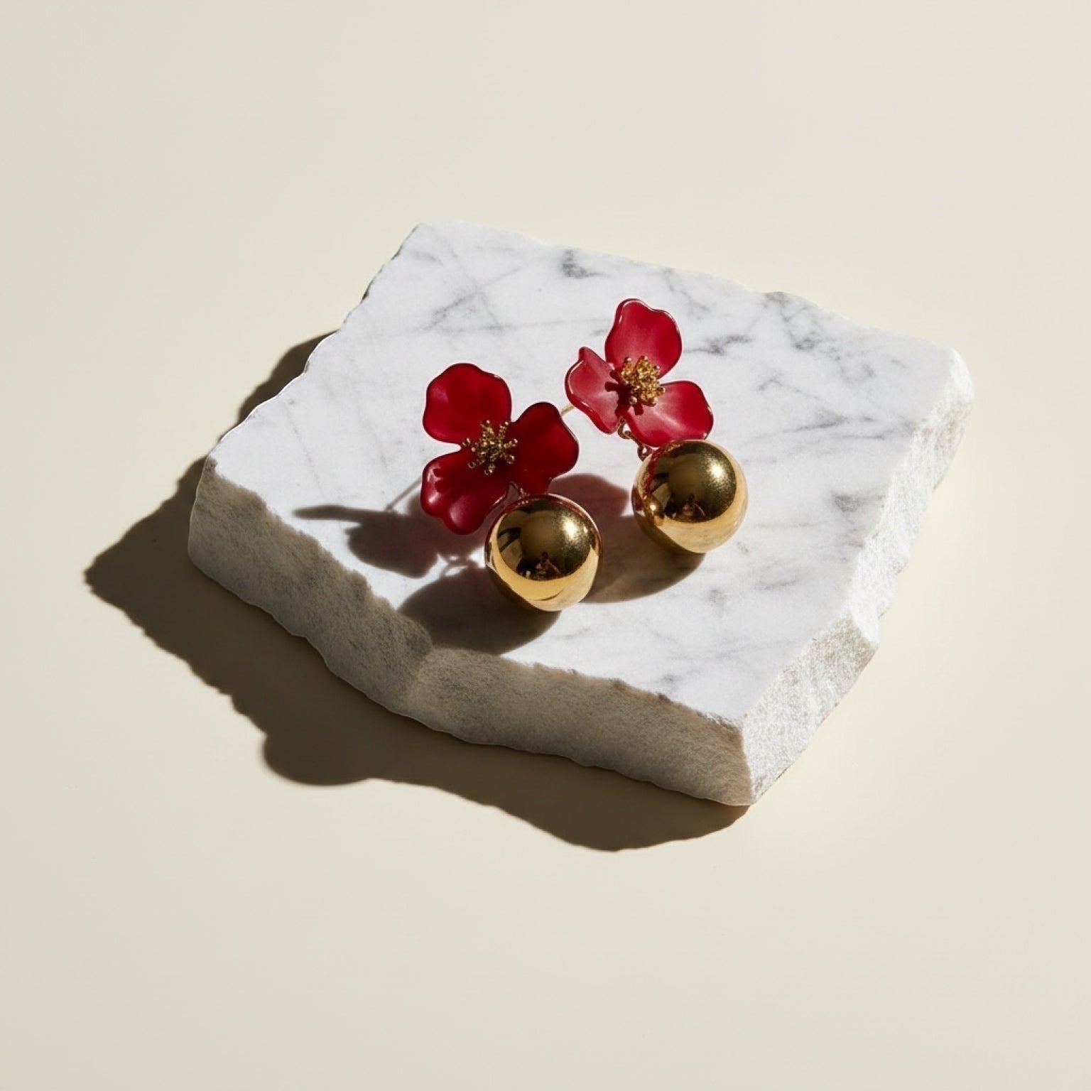 Chévereh red hibiscus floral ball drop earrings with gold centers and polished gold balls, 1 inch length.