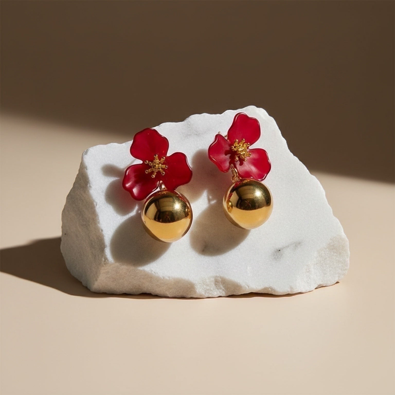Chévereh red hibiscus floral drop earrings with gold ball charms, 18K gold plated stainless steel.