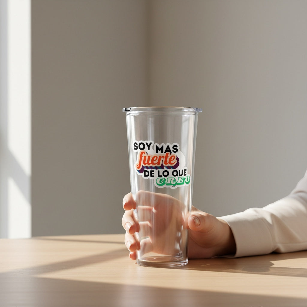 Chévereh Soy Mas Fuerte vinyl sticker with colorful Spanish text on a clear tumbler held by a hand.