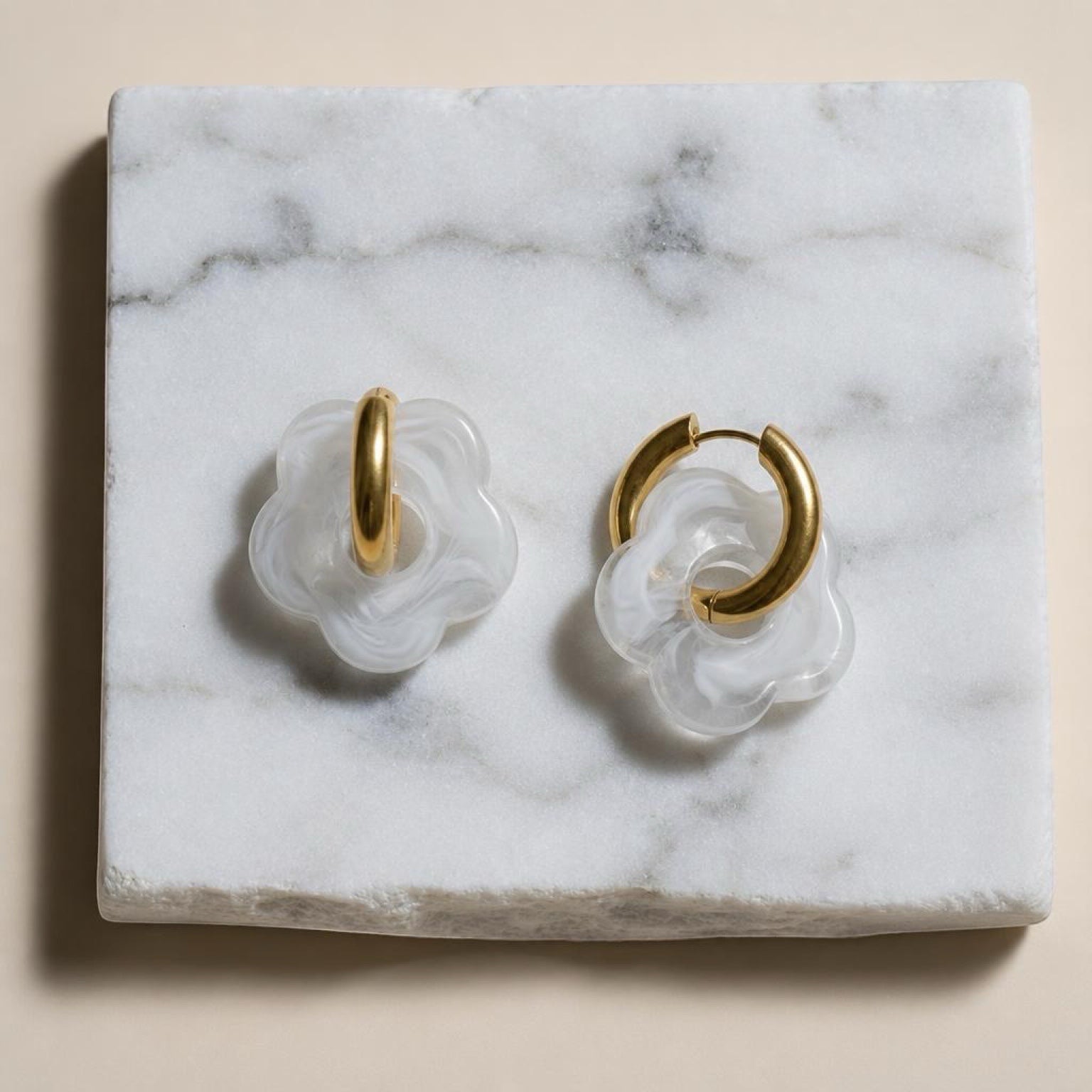Chévereh White Bloom & Gold abstract flower drop earrings with gold hoops and milky white translucent charms.