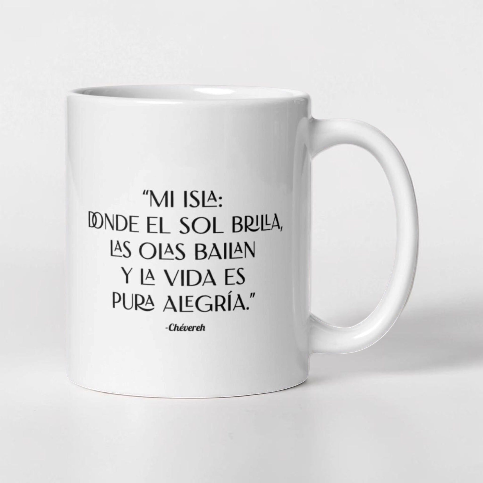 Chévereh white ceramic mug with black text quote "MI ISLA: DONDE EL SOL BRILLA, LAS OLAS BAILAN Y LA VIDA ES PURA ALEGRÍA."